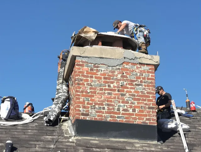 Warren Chimney Sweep installing a custom chimney crown in Warren, RI