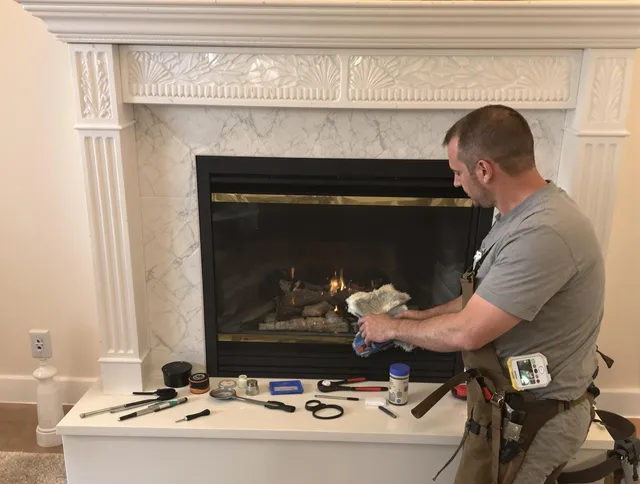 Warren Chimney Sweep performing fireplace maintenance in Warren, RI